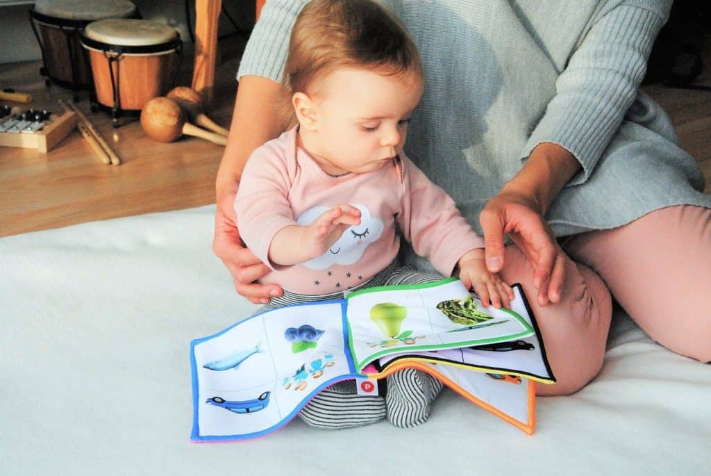 When To Start Reading To Baby baby with cloth book FI